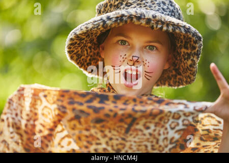 Girl as leopard with creative face painting  in school play Stock Photo