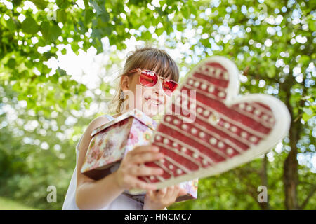 Girl at childrens birthday party in summer in the garden Stock Photo