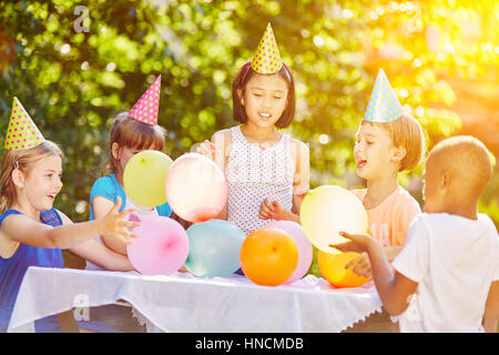 Childrens birthday party in summer with kindergarden group Stock Photo