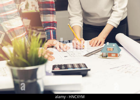 architects team working on new house project in office Stock Photo
