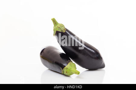 Two whole aubergines isolated on white background Stock Photo