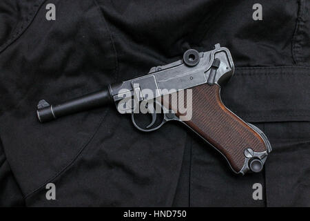 Revolver is black view right. evolver on cloth. Stock Photo