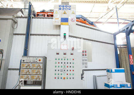 operating console of the modern powerful metal cutting laser mashine at factory. Modern production of metal details. control pane of industrial cnc pl Stock Photo