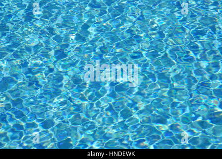 Light refractions in water in swimming pool Stock Photo