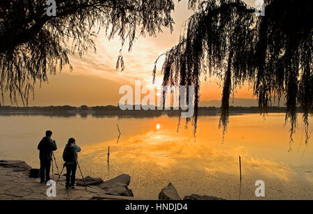 Landscape, sunset, Gardens of Summer Palace, in Kunming lake.Taking photos,Beijing, China Stock Photo