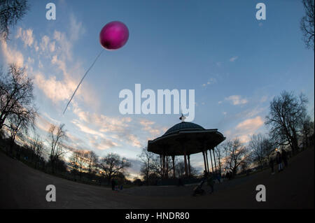 Clapham Common bandstand and a pink helium balloon Stock Photo