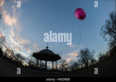 Clapham Common bandstand and a pink helium balloon Stock Photo