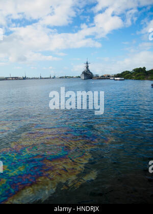 Oil still floats on the top of the water where it was spilled when the USS Arizona was sunk during the attack on Pearl Harbor, Oahu, Hawaii. Stock Photo