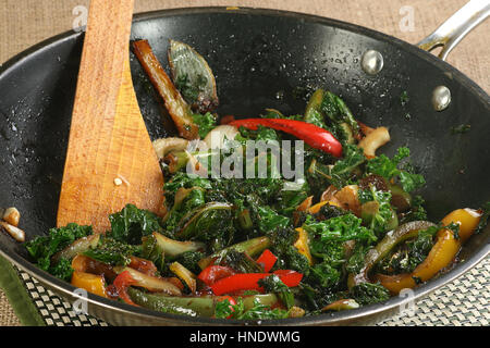 stir fried kale in a pan with onions and mixed peppers Stock Photo