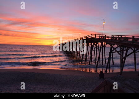 Sunrise over the pier in Kure Beach North Carolina Stock Photo