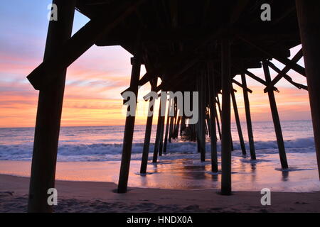 Sunrise over the pier in Kure Beach North Carolina Stock Photo