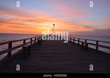 Sunrise over the pier in Kure Beach North Carolina Stock Photo