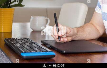 hand using stylus pen and graphic tablet Stock Photo