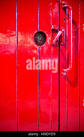 red painted wooden door on railway wagon Stock Photo