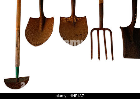 Old Gardening tools hanging on the wall isolated on white Stock Photo