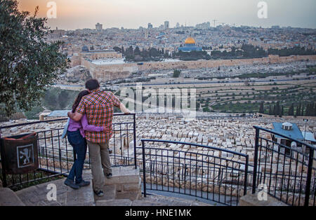 love, lovers, romantic, sunset, couple, woman, man, Mount olives, View of Jerusalem from Mount Olives, Jerusalem, Israel. Stock Photo