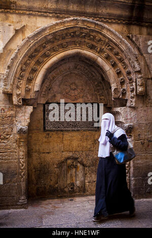 Woman, niqab, Ala´e Din street, muslim Quarter,Old City, Jerusalem, Israel. Stock Photo