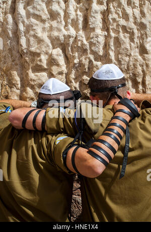 Wailing Wall, Western Wall, soldiers praying, men, men's prayer area, Jewish Quarter, Old City, Jerusalem, Israel. Stock Photo