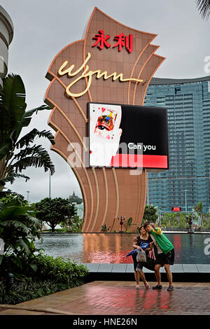 Selfie, tourists, Couple taking picture in Main entry to Wynn hotel & casino,Macau,China Stock Photo