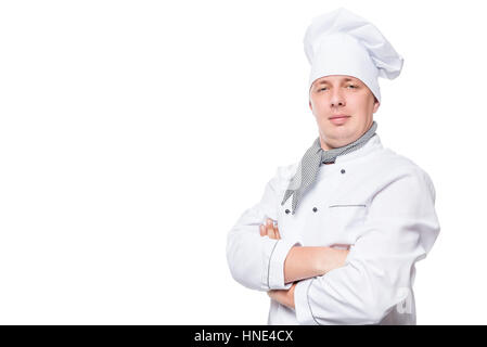 chef in uniform and a white space on the left background Stock Photo