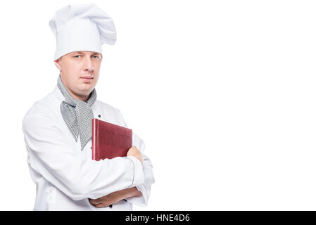 cute chef with a menu in his hands posing on a white background Stock Photo
