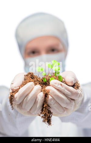 Vertical portrait of a biologist in a suit with the germ in the hands Stock Photo