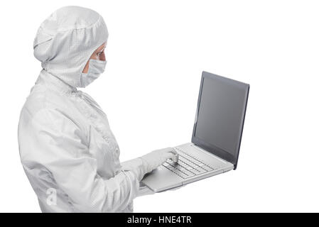 in a protective suit Scientist working with laptop isolated Stock Photo