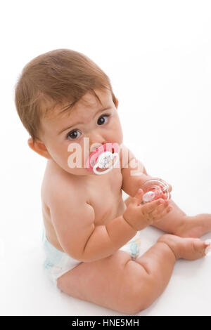 Model release, Kleinkind, 8 Monate, mit Schnuller - little child with soother Stock Photo