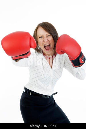 Model release, Junge Geschaeftsfrau mit Boxhandschuhen - young business woman with boxing gloves Stock Photo