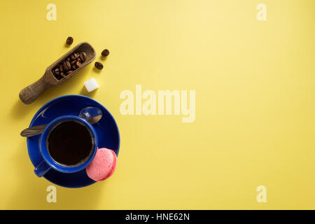 coffee cup and beans at yellow  background texture Stock Photo