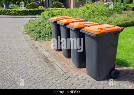 Row of european grey waste bins along street Stock Photo