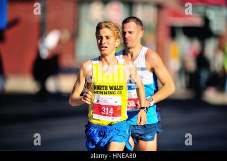 Zachary Hoagland of the United States during the 2016 Chicago Marathon as he ran through the city's Chinatown neighborhood. Stock Photo