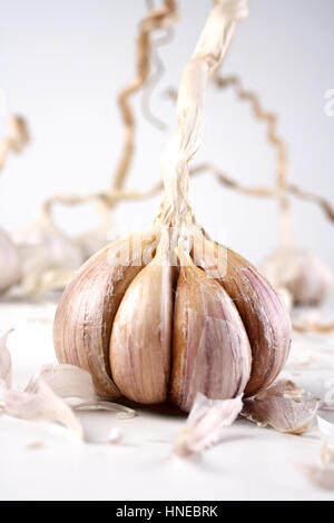 single garlic clove shot on a wooden background Stock Photo - Alamy