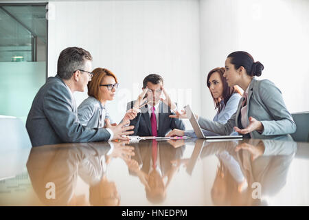 Businesspeople arguing in meeting Stock Photo