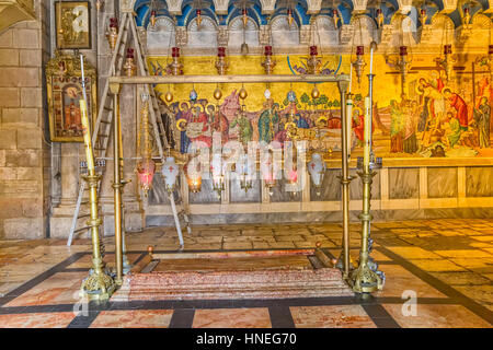 The Stone of Anointing, where Jesus' body is said to have been anointed before burial, in Church of the Holy Sepulchre in Jerusalem Israel.