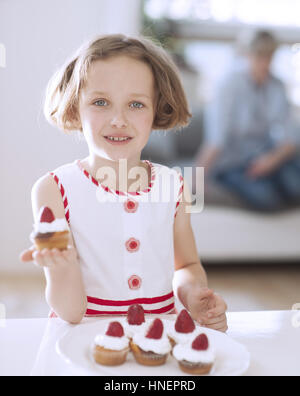 Young girl holding cup cake Stock Photo