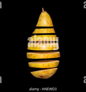 Flying pear. Sliced pear isolated on black background. Levity fruit floating in the air Stock Photo