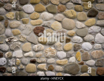 Rock wall of natural river stones Stock Photo