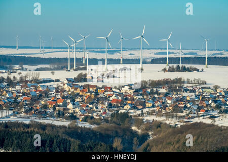 Wind turbines in the snow, wind farm behind the district Essentho Marsberg, Sauerland, North Rhine-Westphalia, Germany