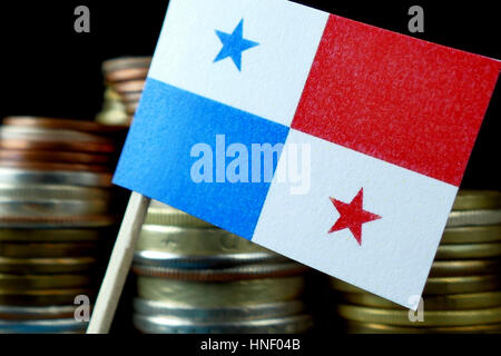 Panama flag waving with stack of money coins macro Stock Photo