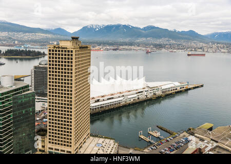 Vancouver, Canada - January 28, 2017: Vancouver city with Canada Place and mountains in the background Stock Photo