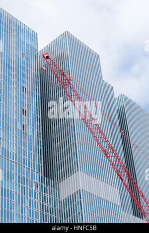 ROTTERDAM, NETHERLANDS - MAY 14, 2016: Construction crane in front of the famous skyscraper 'the rotterdam'. It is a multifunctional building on the W Stock Photo