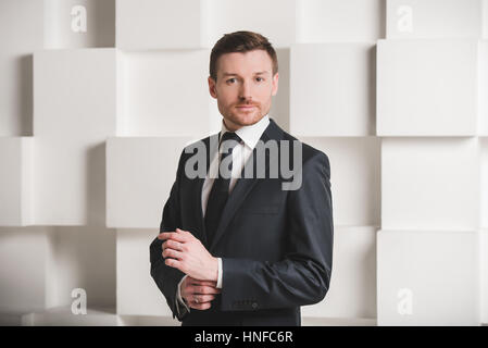 Portrait of man in black suit, groom, businessman concept Stock Photo