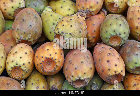 Fresh Opuntia ficus-indica (Indian fig, Prickly pear) cactus fruits sale on retail market stall display, close up Stock Photo