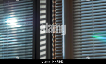 The sun is glow shining through the blinds Stock Photo