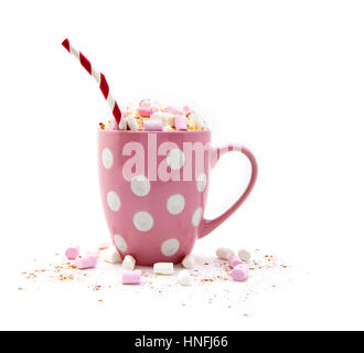 Hot Chocolate in a pink mug with marshmallows and a red and white striped straw on a white background Stock Photo