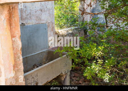 Kitchen Sink, Window View – Interior of a Derelict WW2 Building, Baia Sardinia, Sardinia Italy. Stock Photo