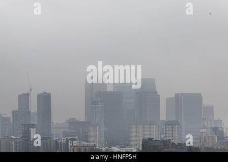 London, UK. 12th February, 2017. UK Weather: Fog over London and Canary Wharf business park buildings © Guy Corbishley/Alamy Live News Stock Photo