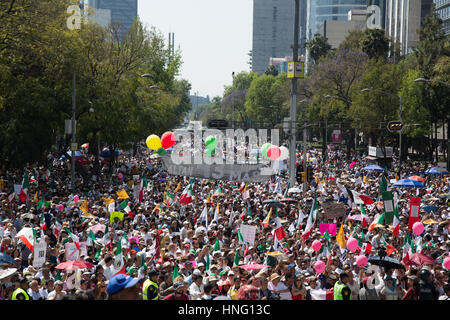 Mexico City, Mexico. 12th February 2017. Thousands hold Mexican flags and signs against US President Donald Trump during an anti-Trump march in Mexico City, Mexico on February 12, 2017. Credit: Benedicte Desrus/Alamy Live News