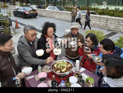 Hong Kong, China. 12th Feb, 2017. Villagers have a basin meal in Daputou Village, Hong Kong, south China, Feb. 12, 2017. Basin Meal is a folk custom here in Hong Kong during festivals. Credit: Wang Shen/Xinhua/Alamy Live News Stock Photo